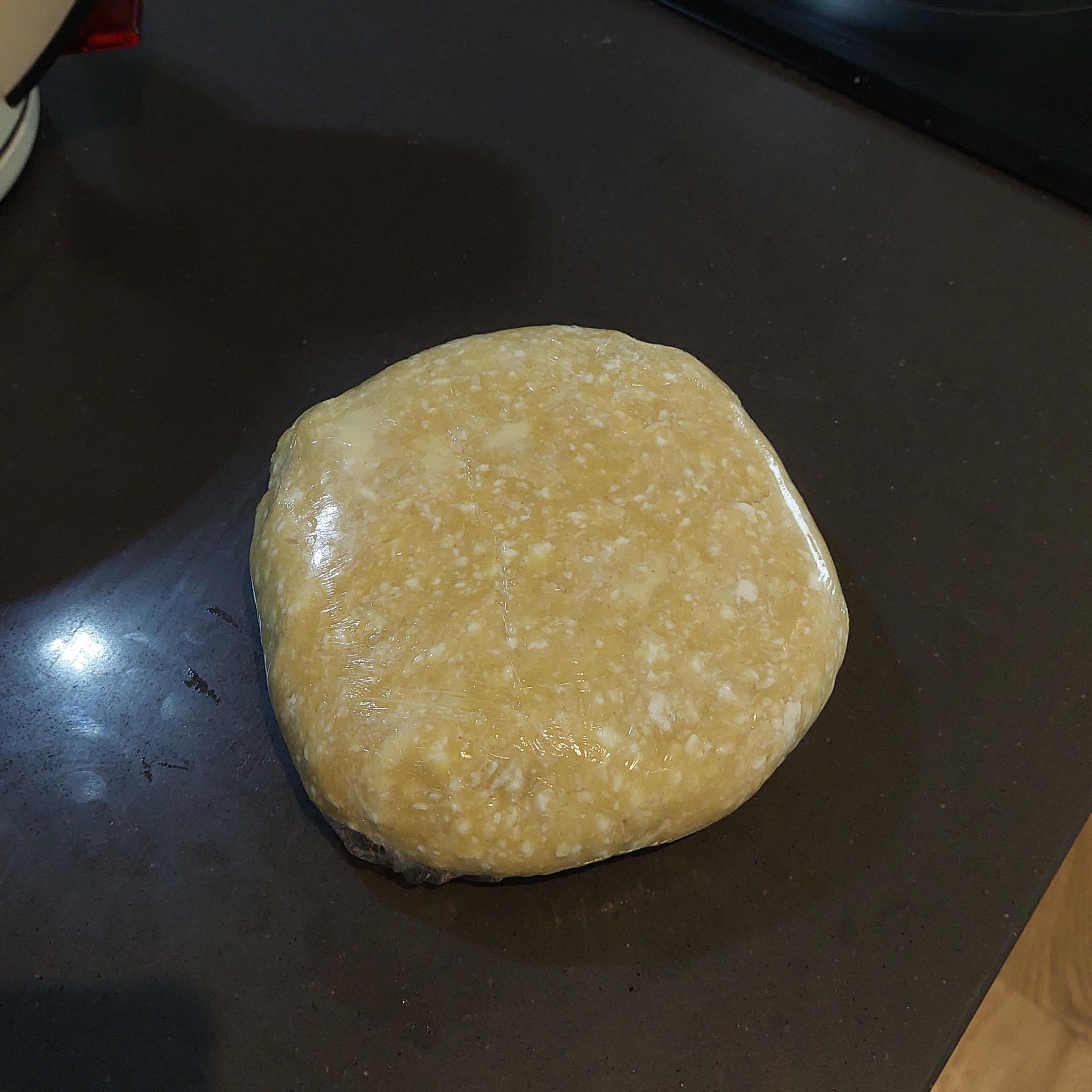 Wrap the ball into cling film, slightly flatten it and leave in freezer for 25-30 minutes or fridge for 1 hour.